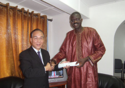 dr bah receiving cheques from ambassador chen