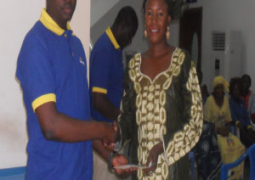 one of the winners receiving her prize