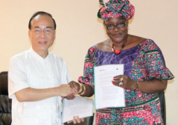 ambassador chen exchanging document with ps niang