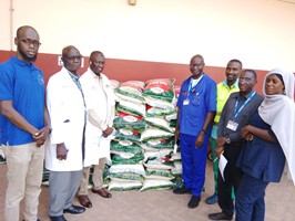 Africmed strengthens staff morale with bags of rice