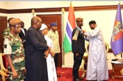 Barrow confers CORG insignia on Senegalese army major