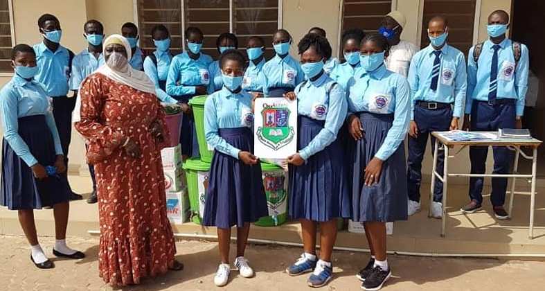 Charles Jow Alumni donates 1000 face masks, buckets to school