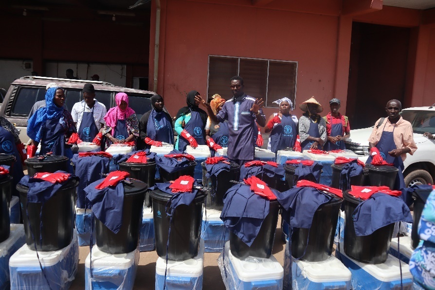DoF hands over fish preservation coolers, gloves to 250 women