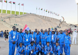 Gambian team return home