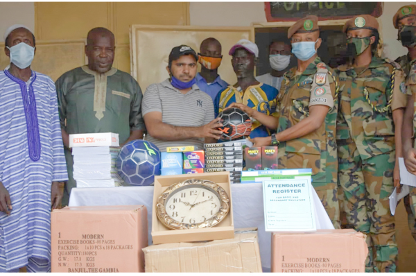Ghanaian troops donate to Mbullum Ahmadiya Muslim schools to mark national day
