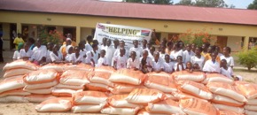 HELPING gives rice to sponsored students