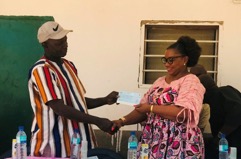 ECOWAS presents cheque, learning materials to Latriya LBS