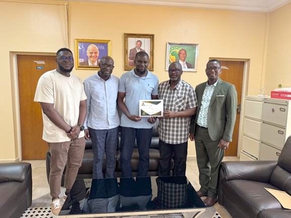 Gaffer Yahya Manneh presents CAF A License coaching certificate to GFF leadership