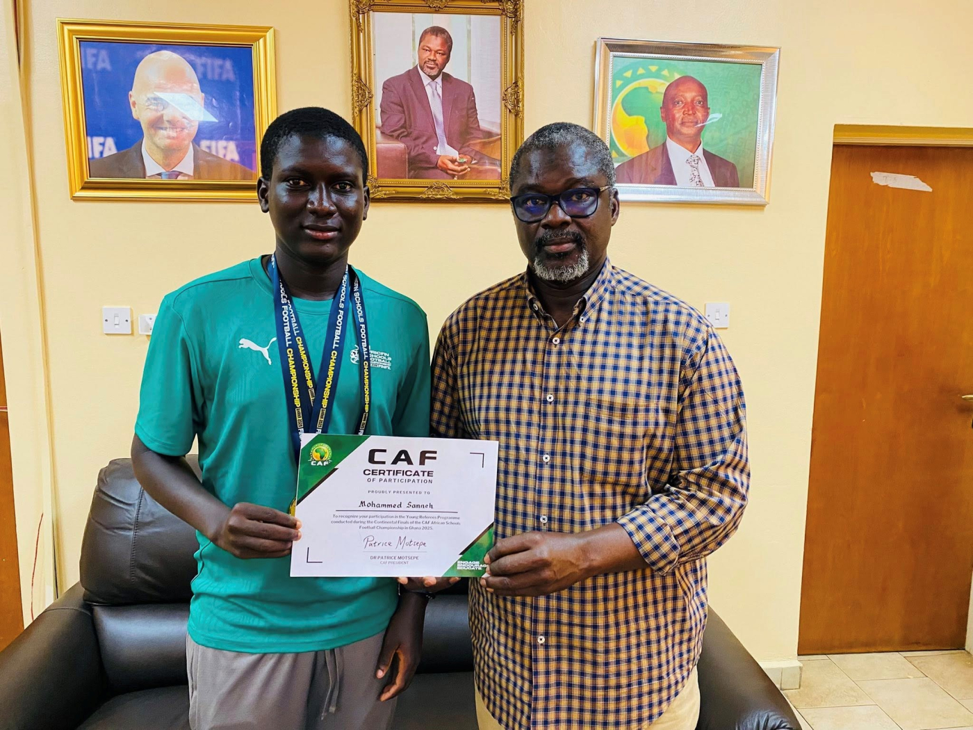 GFF prexy receives young referee Muhammed Sanneh at Football House