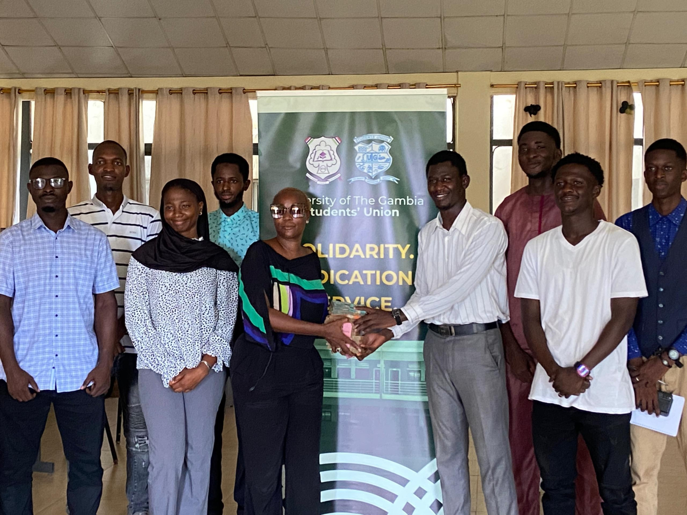 Nenneh Cheyassin presents D250,000 to UTG Law Students
