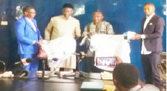 Tijan Jaiteh presents sports materials to regional sports committees