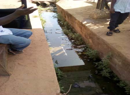 Drivers, roadside vendors grumble over open gutters