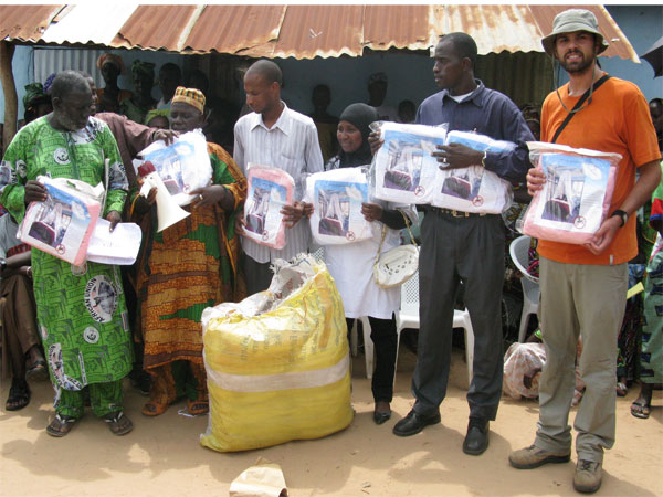 Global Unification Donates Mosquito Nets to the people of Mandinaring