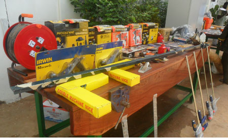 President Jammeh presents carpentry tools to young carpenter