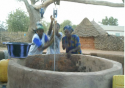 youna women struggling to fetch water from well