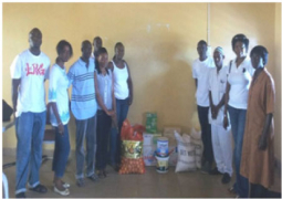 access bank staff handing over the donated items