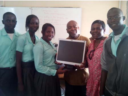 Glory Baptist school receives computers, kits