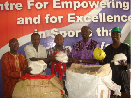 Spanish-based Gambians present sports materials to minister
