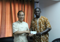 sg sabally receiving cheque from ambassador chen