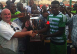 alagie nyabally receving trophy