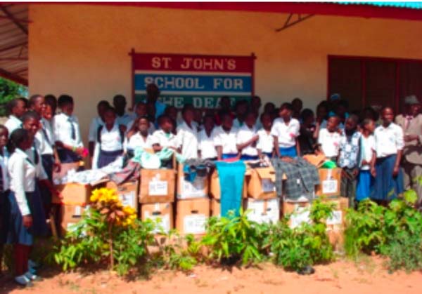 American group donates clothes to St. John’s School for the Deaf  
