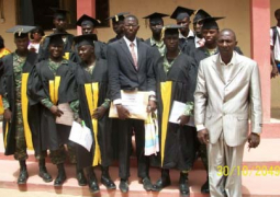 graduands with school director lamin kanteh