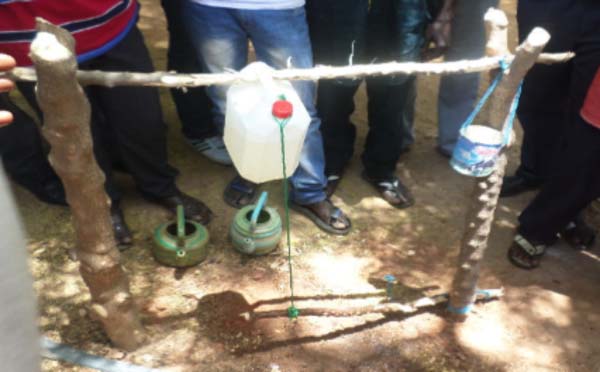 Teachers trained on construction of local hand-washing stations (Tippy Taps)
