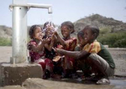 school children celebrating water availability