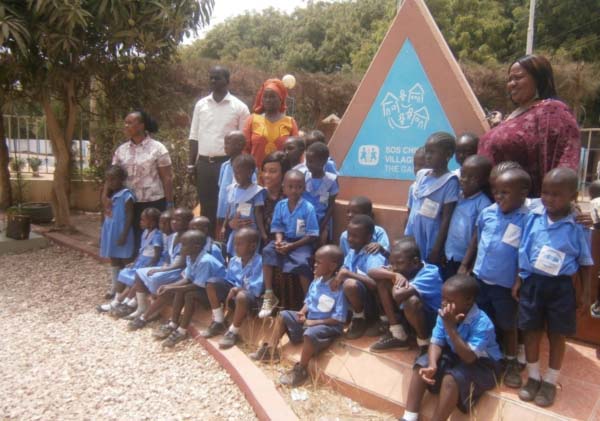 Young West African gives 350 text books to SOS Children Village