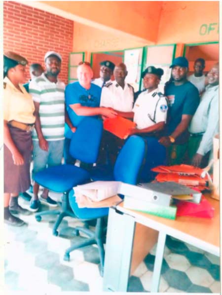 UK Enterprise, Farm4Life donate office materials to Bundung Police Station