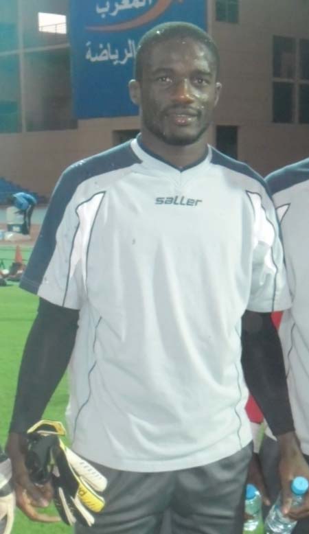 Goalkeeper Christopher Allen hangs up glove
