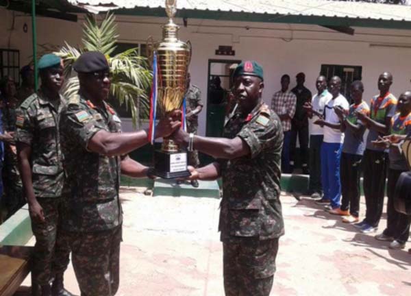 Gambia Armed Forces FC present league trophy to CDS Kinteh