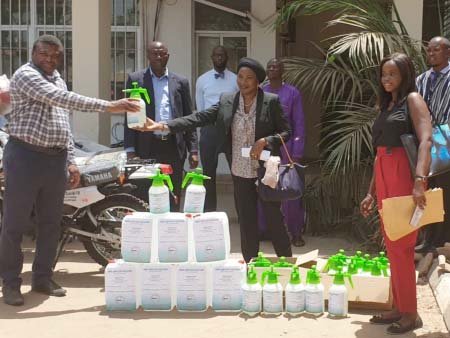 Pharmaceutical Society of Gambia give Locally made hand Sanitizers to MoH